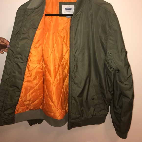 green jacket with orange inside
